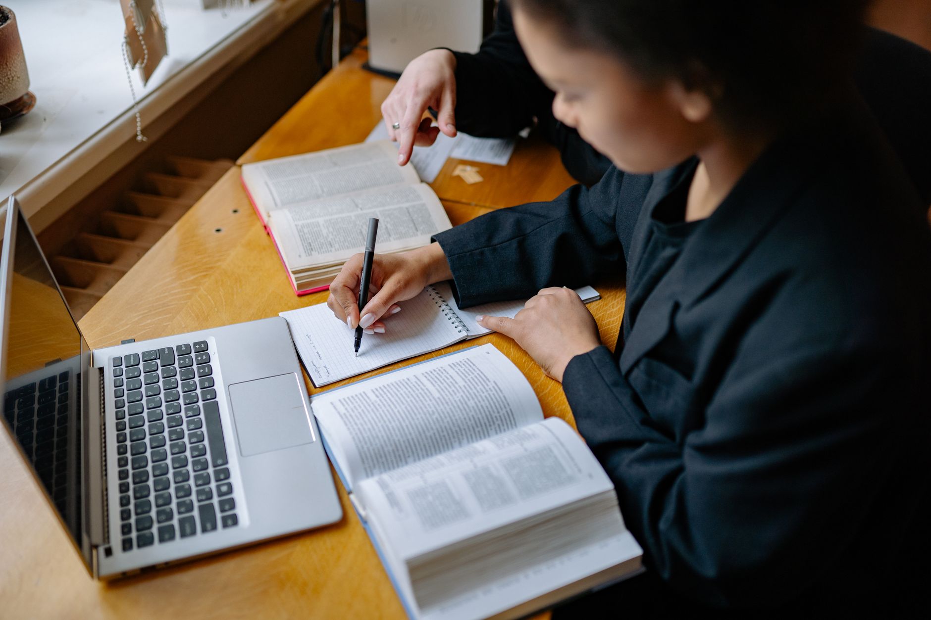 Students using laptop for note-taking and productivity with AI tools