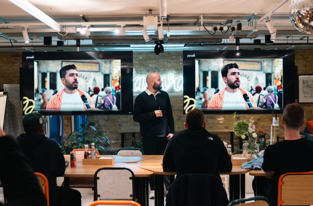 Best AI Presentation Tools in 2026: Gamma vs Beautiful.ai vs Canva AI — Which Should Indian Creators Choose? Professional giving a digital presentation — AI presentation tools comparison 2026