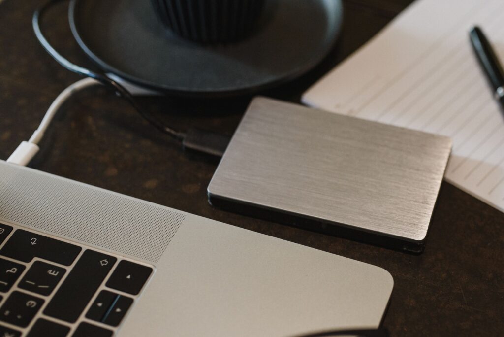 Google Drive vs Dropbox vs OneDrive in 2026: Which Cloud Storage is Best for Indian Students and Professionals? External hard drive and laptop for cloud storage backup comparison