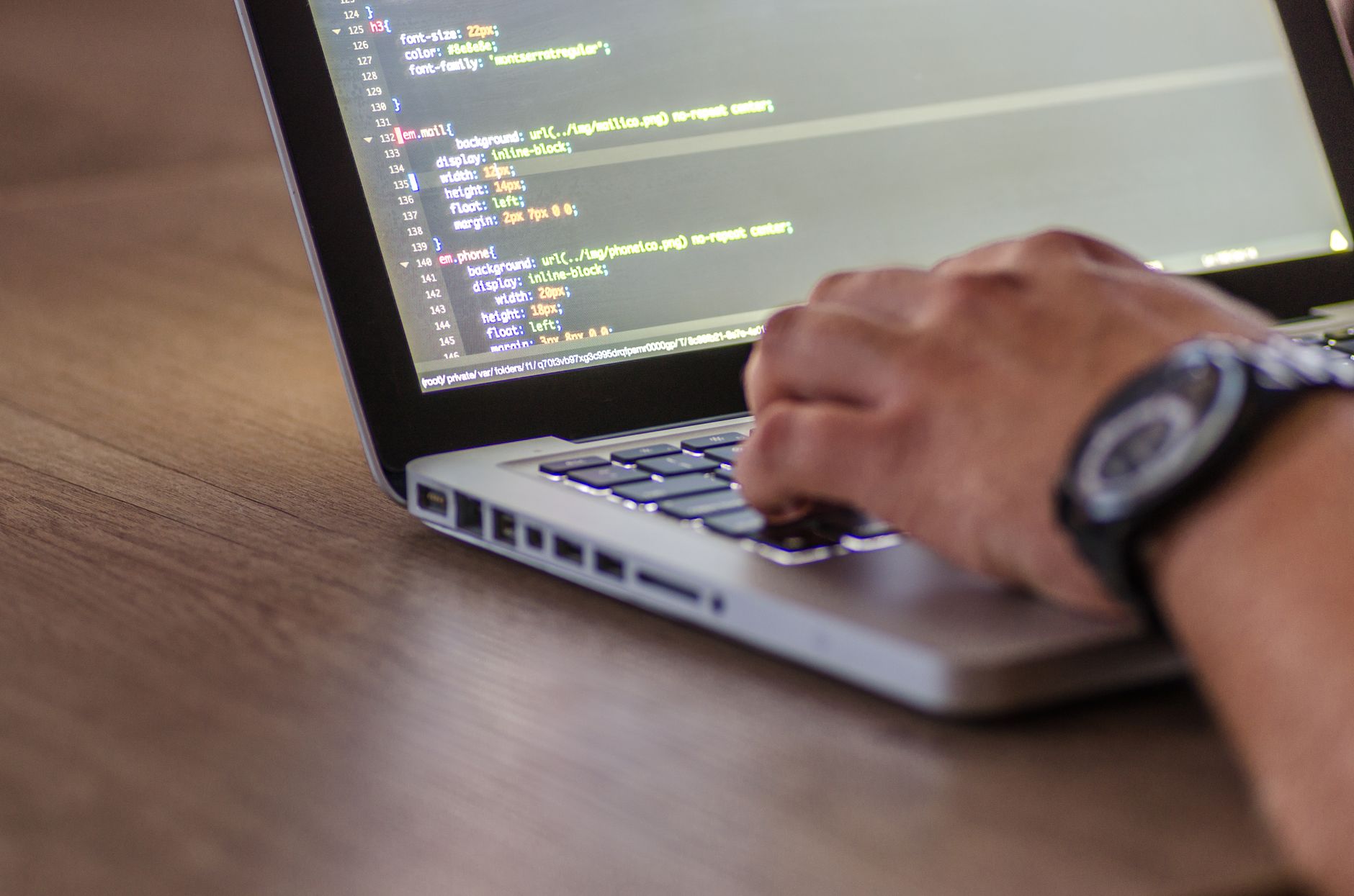 Developer checking website speed metrics on laptop — troubleshooting slow loading websites in India 2026