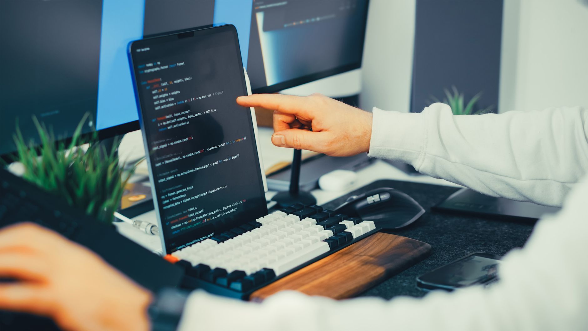 Supabase vs Firebase in 2026: Which Backend Is Best for Indian Developers? A programmer working on code with laptop and monitor setup comparing Supabase and Firebase backend options