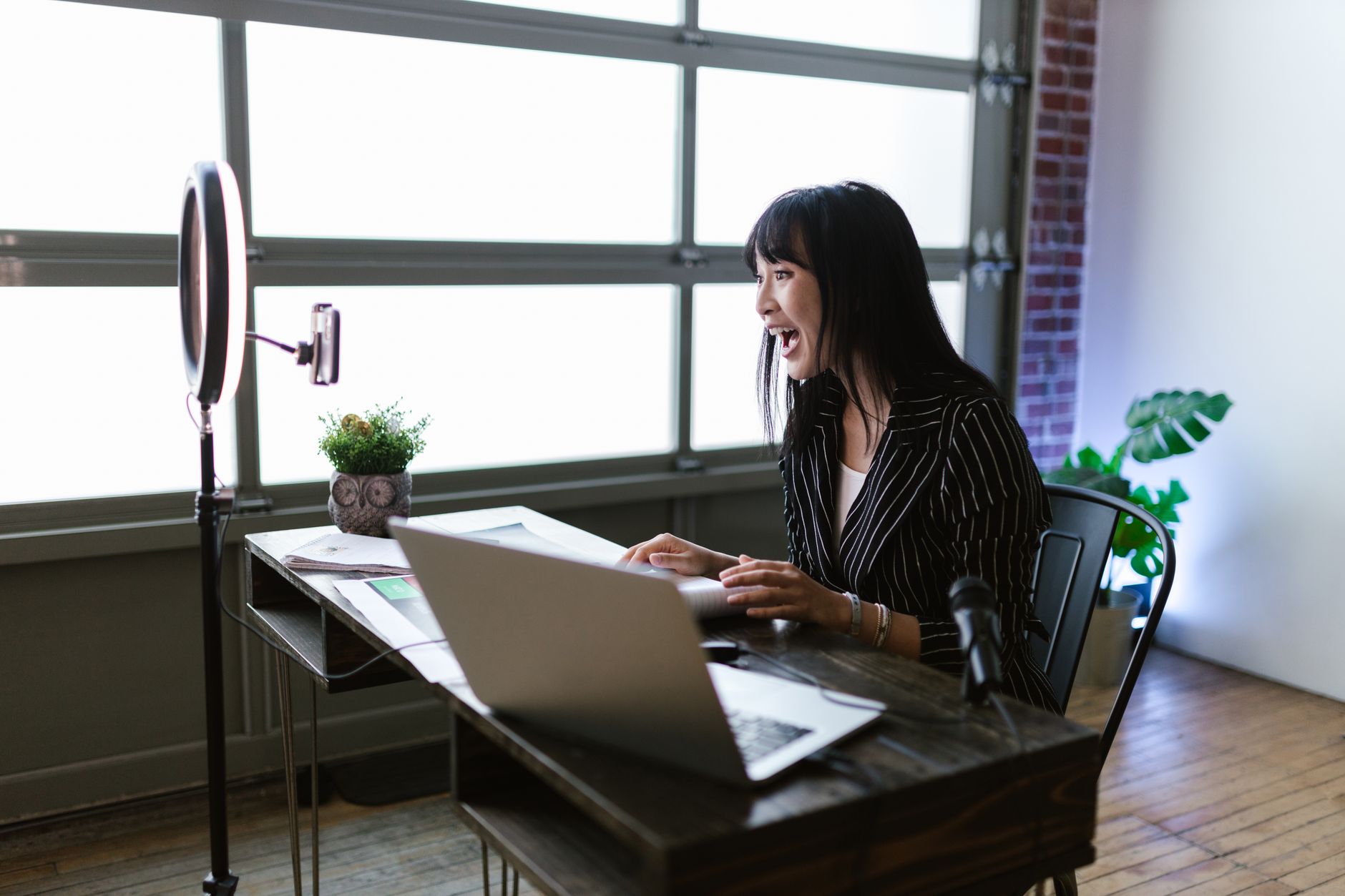 Best Free Screen Recording Tools in 2026: OBS vs Loom vs Screencastify vs ShareX for Indian Creators Asian woman recording content with a laptop and ring light in an office setup, representing content creators using screen recording tools