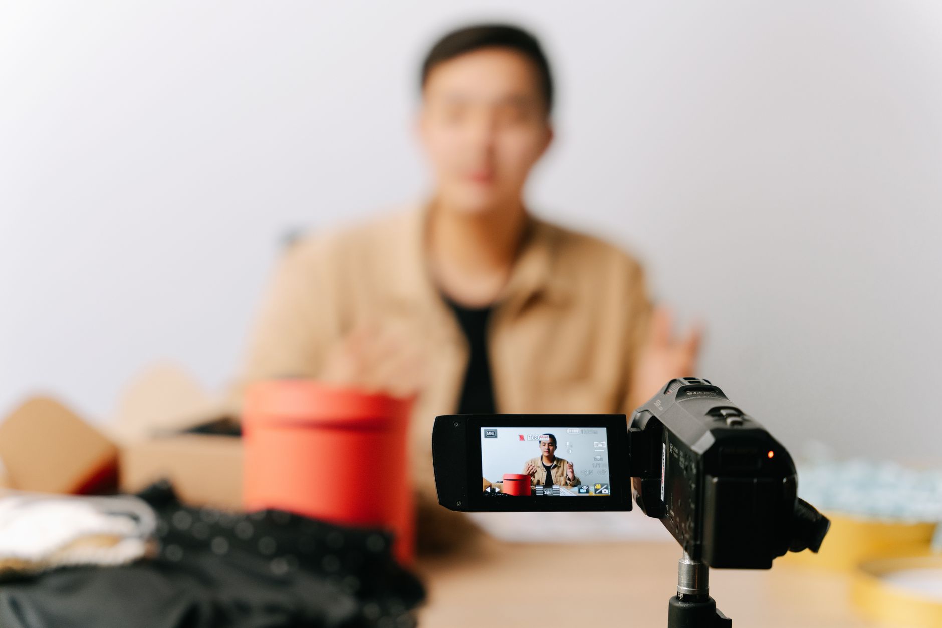 Content creator filming video with camera for YouTube and social media production