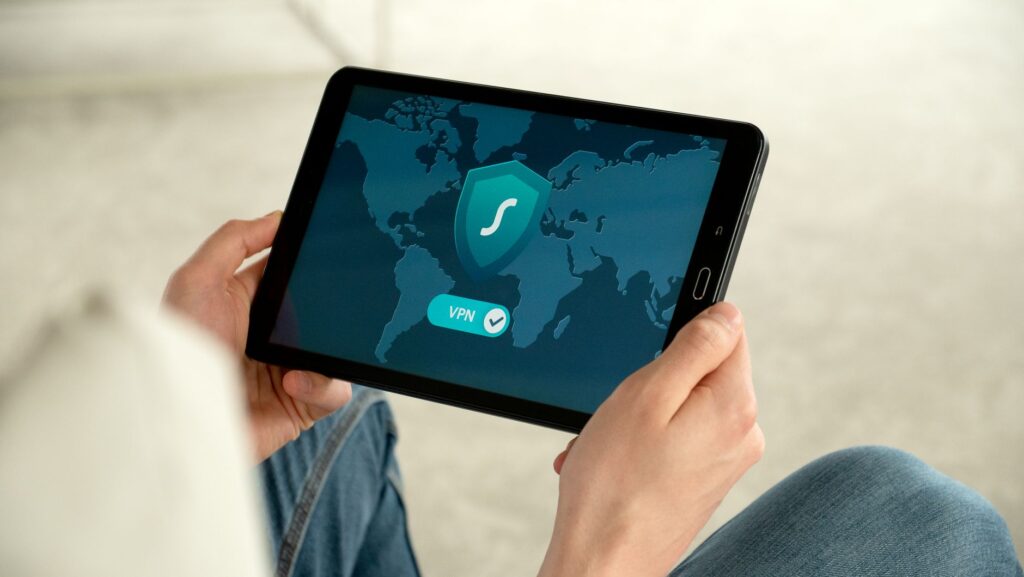 Best VPN Services in India 2026: NordVPN vs ExpressVPN vs Surfshark vs ProtonVPN Compared Person using VPN on tablet for secure internet browsing India 2026