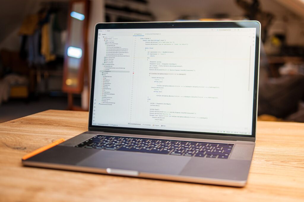 Best Free Project Management Tools in 2026: Trello vs ClickUp vs Asana vs Notion for Indian Teams and Freelancers Developer coding on laptop for project management comparison guide