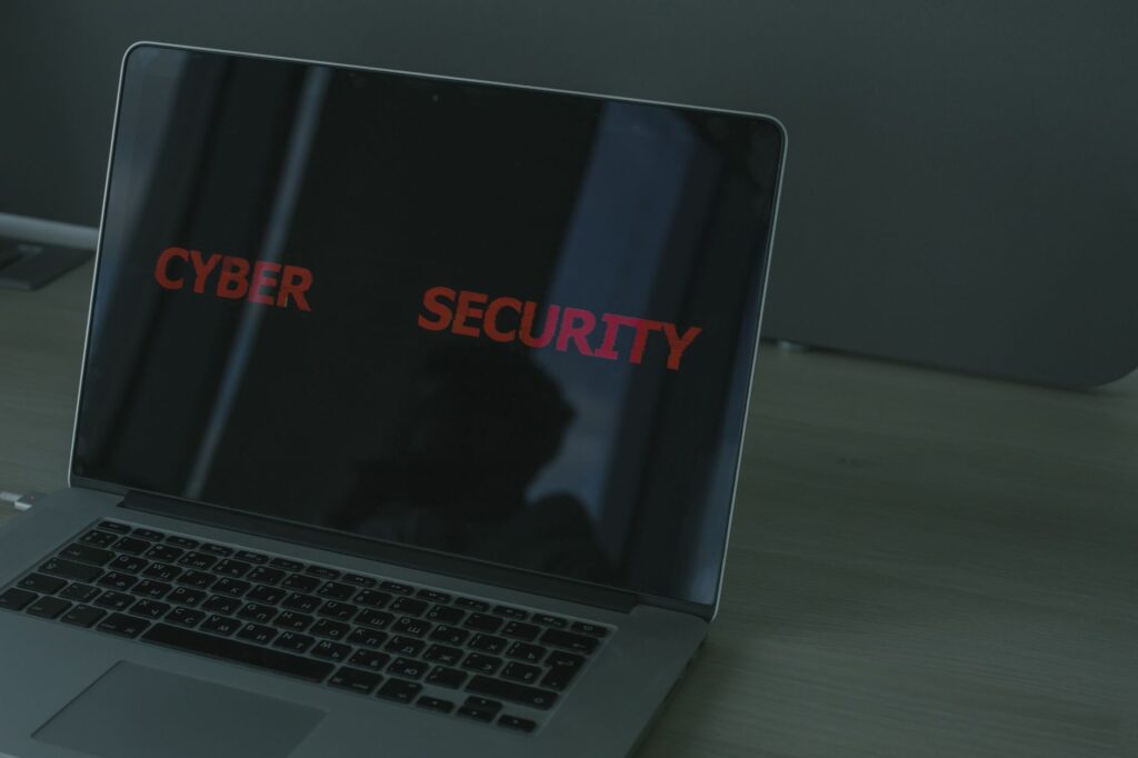 Laptop displaying cybersecurity text emphasizing digital security and online privacy themes
