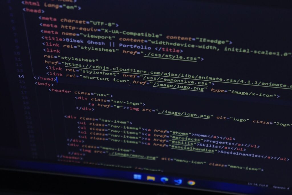 Linear vs Jira vs GitHub Issues in 2026: Which Issue Tracker Is Best for Indian Developer Teams? HTML code on computer screen for web development and personal website building