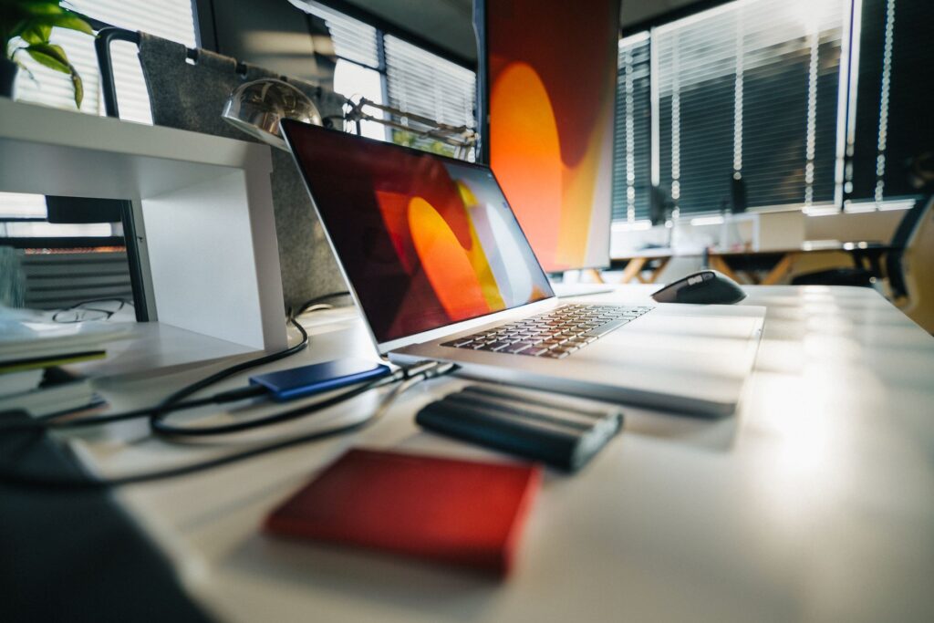 Best Free Cloud Storage in India 2026: Google Drive vs OneDrive vs Dropbox vs pCloud Compared Cloud storage comparison - laptop with external drives on desk