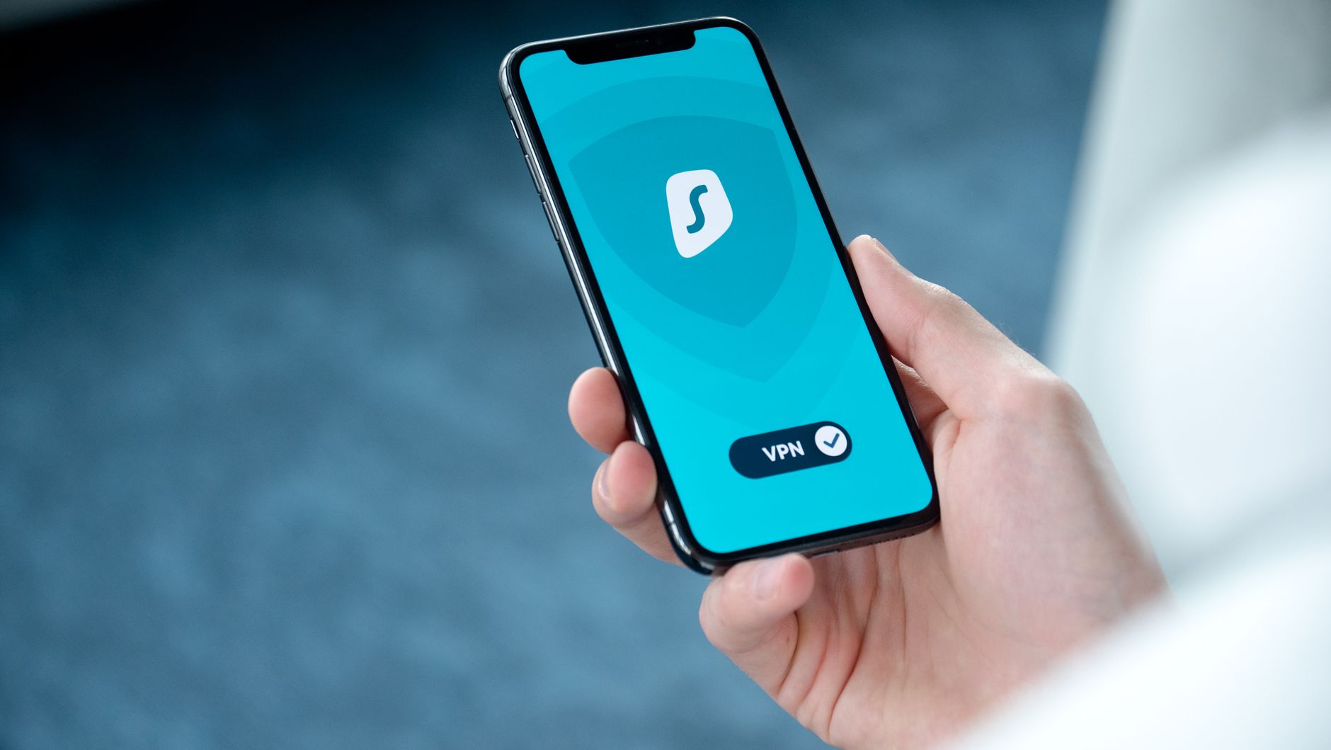 Signal vs WhatsApp vs Telegram for US Users Hand holding a smartphone displaying a security app for private messaging