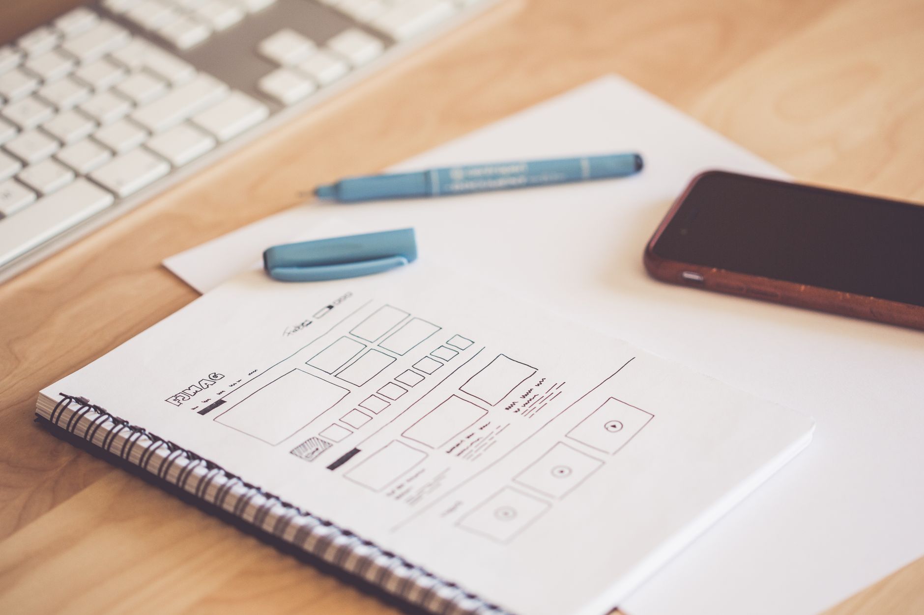 Figma vs Penpot in 2026: Which Design Tool Should Indian Developers and Designers Choose? Design workspace with wireframe sketchpad and keyboard for web design prototyping
