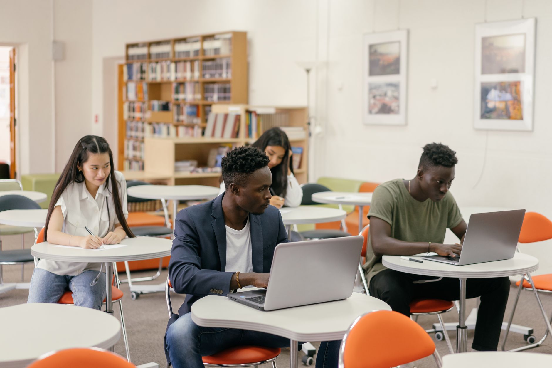 Best Free AI Presentation Makers in 2026: Gamma vs Beautiful.ai vs Canva Slides vs Tome for Indian Students and Professionals Students using AI presentation software on laptops — comparing free presentation makers for Indian students