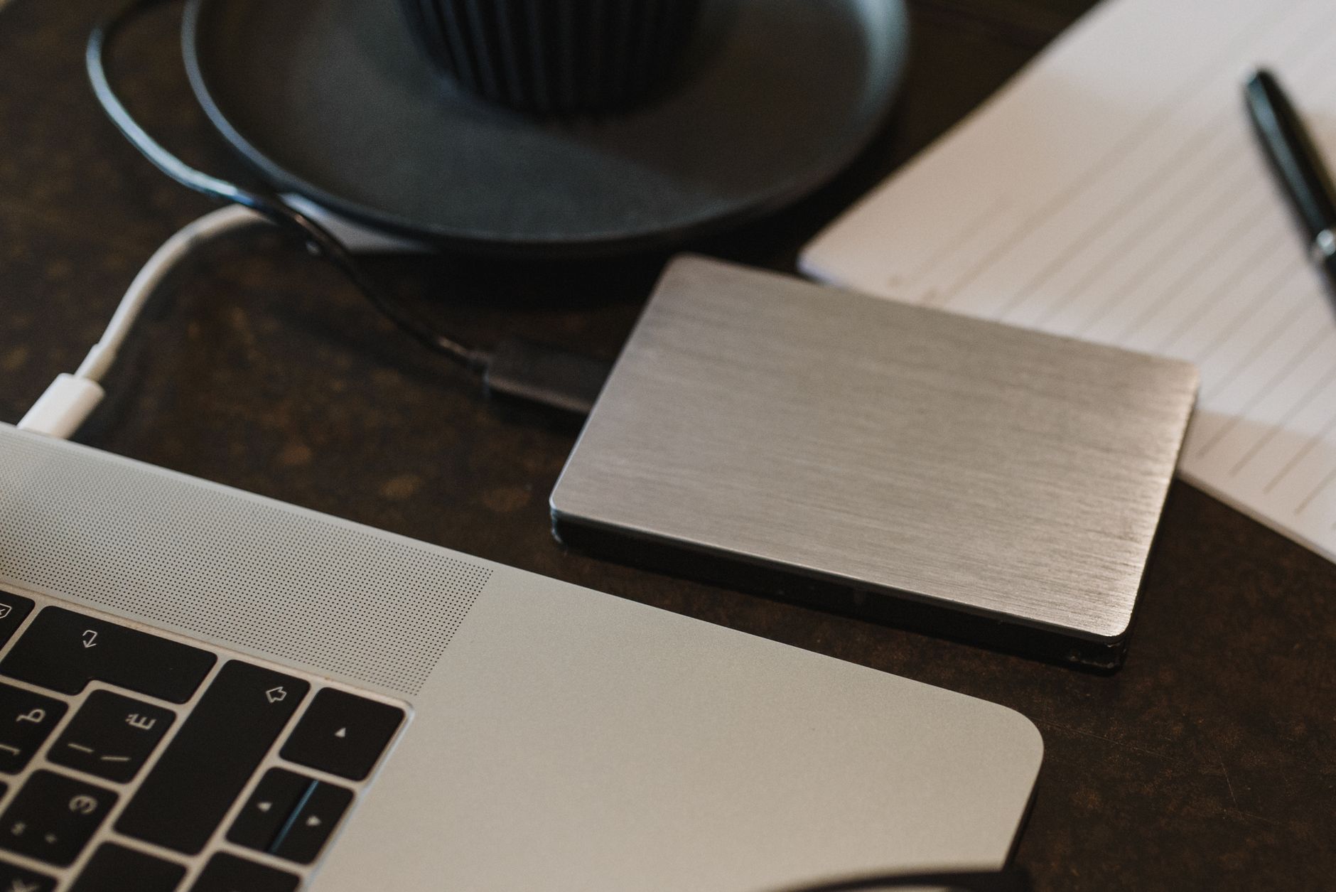 External hard drive connected to a laptop — comparing local storage versus cloud storage backup options for Indian users