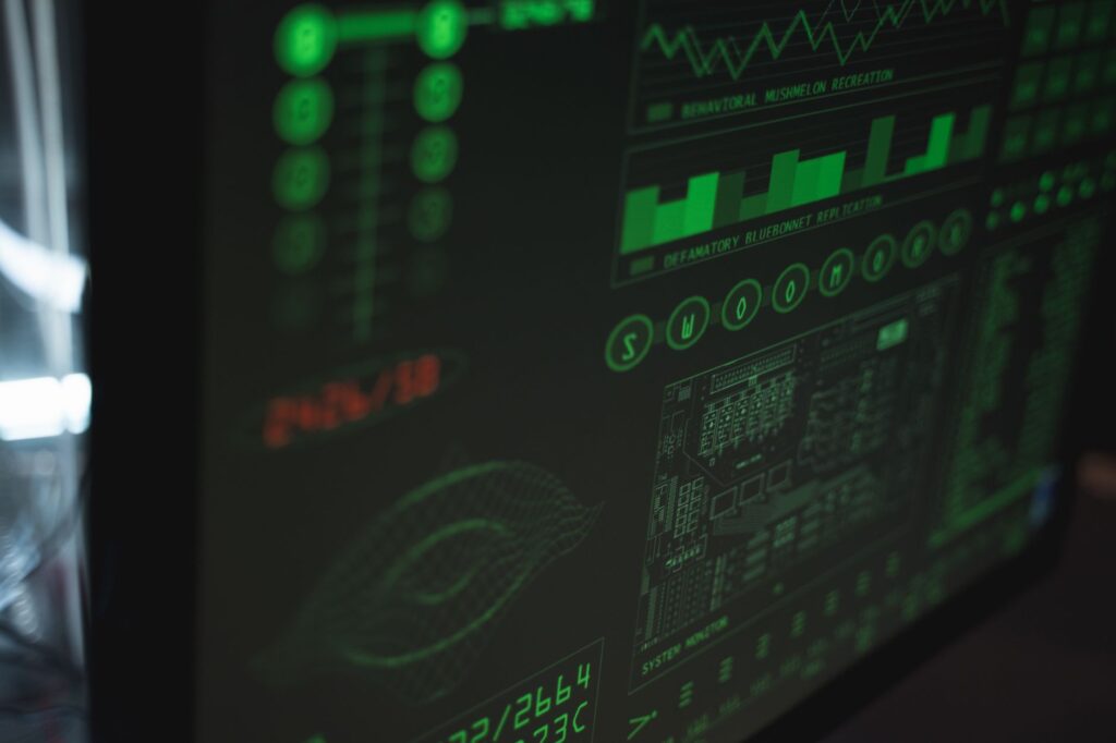 Computer screen displaying cybersecurity and website monitoring dashboard interface