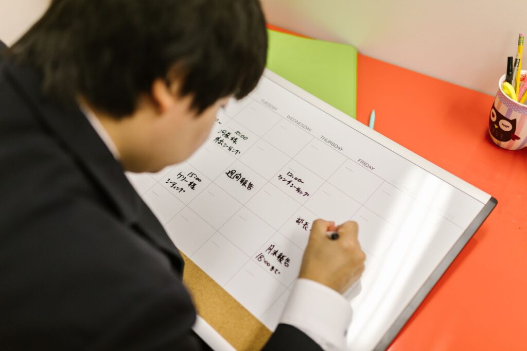 Professional organising weekly schedule in planner for AI scheduling tools comparison