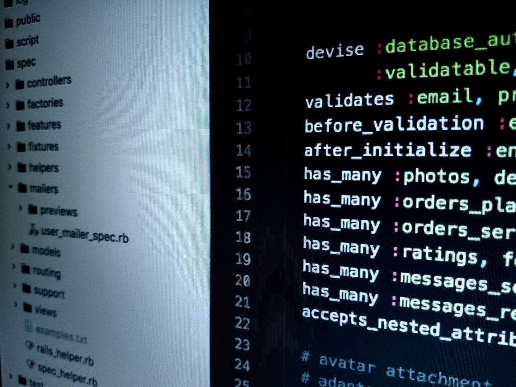 Software developer writing API code on computer — programming and testing