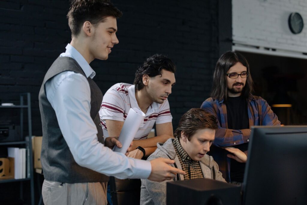 Professionals collaborating on project management software — Linear vs Jira vs Asana comparison