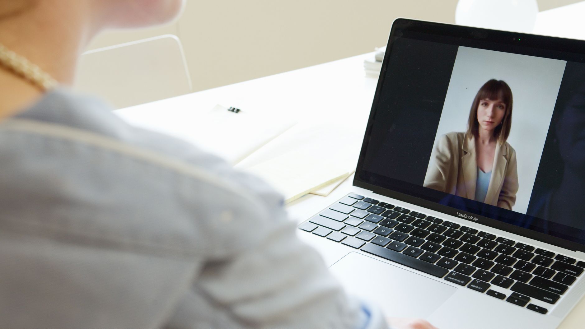 Screen Recording Tools 2026: Loom vs Tella Woman on video call using laptop in modern workspace representing screen recording and collaboration tools